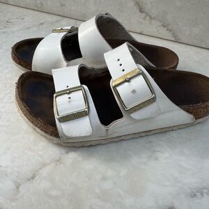 Birkenstock White Sandals with Metallic Buckles